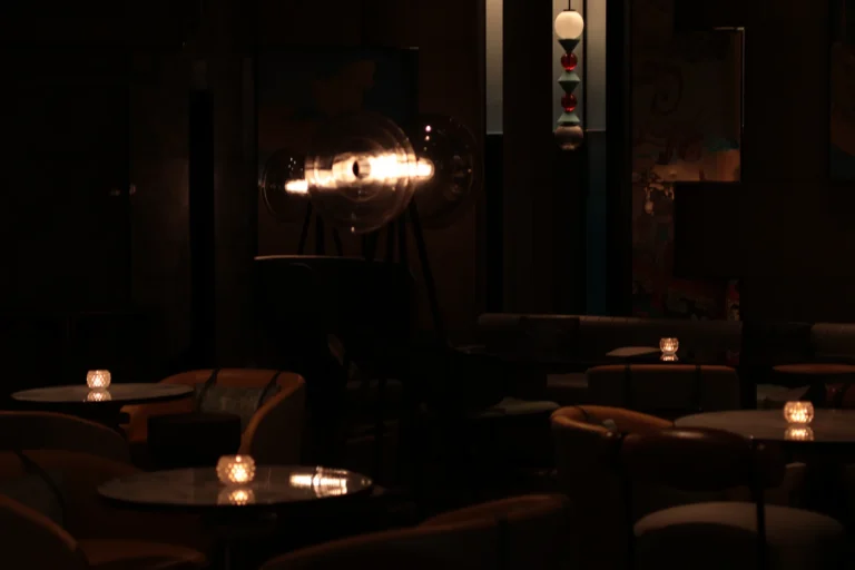 Dark lounge with candles on small tables